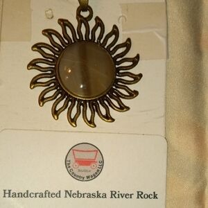 Handcrafted Nebraska River Rock Sunburst Pendant with Brown Stone